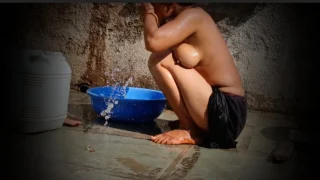 Outside The Outdoor House, In The Courtyard, The Stepsister Is Bathing Openly Completely Naked, The Very Beautiful Slender Waist, Big Boobs, The Beauty Is Showing Youth.